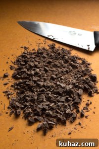 Homemade Chocolate Hazelnut Rum Truffles Recipe 4 chopped chocolate on a cutting board