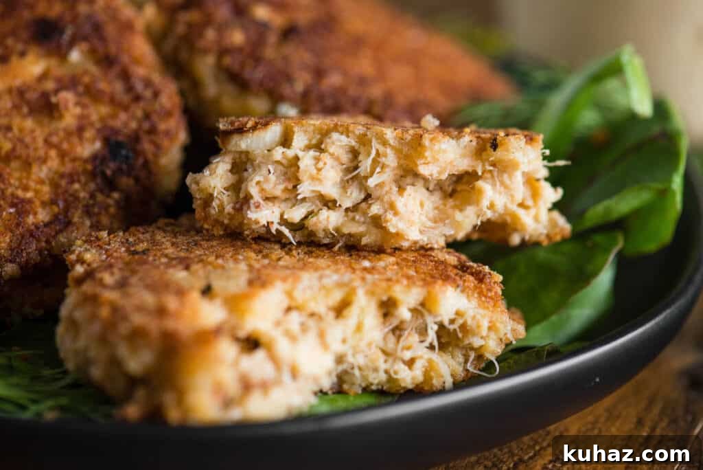 crab cake split in half on platter.