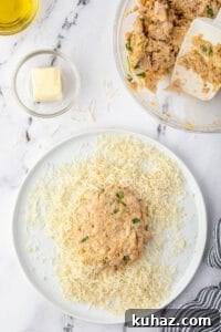 coating crab cake in bread crumbs