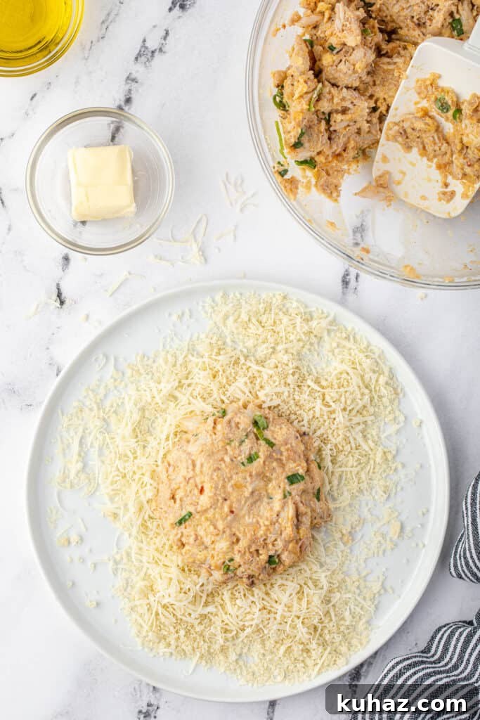 coating crab cake in bread crumbs