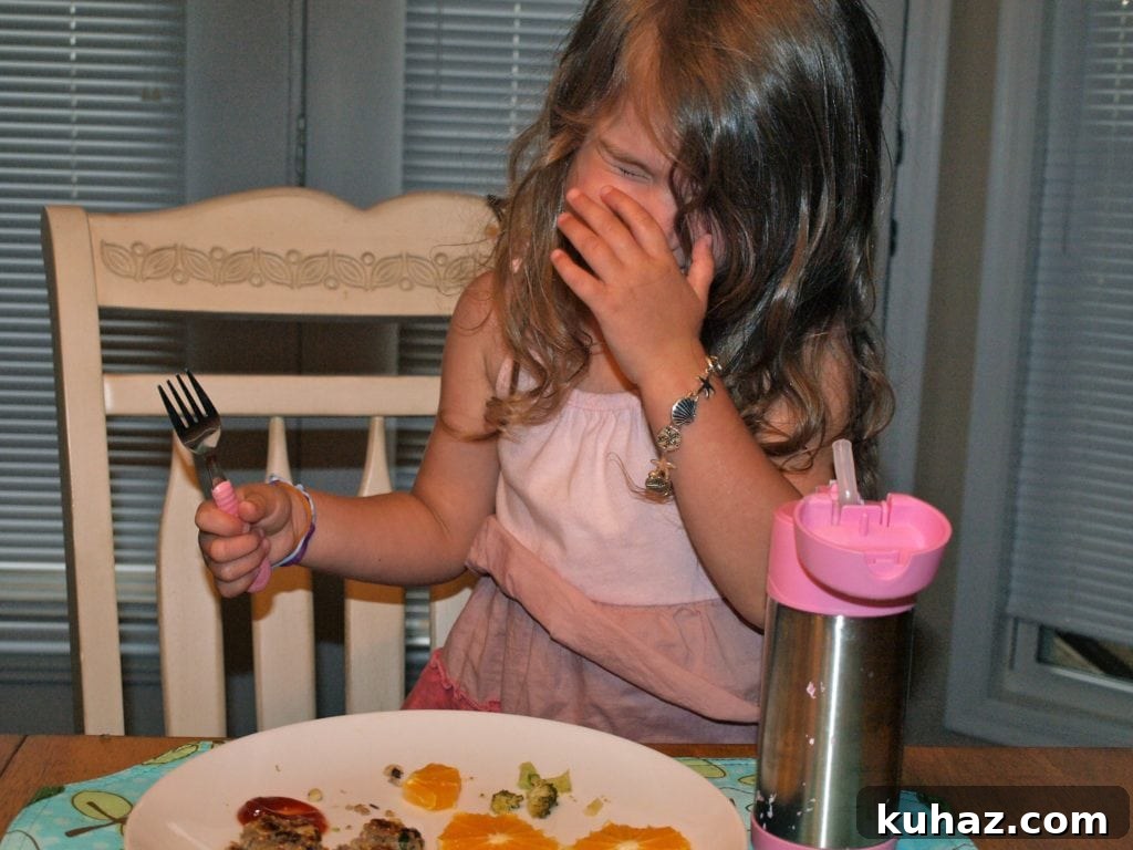 Meghan eating broccoli