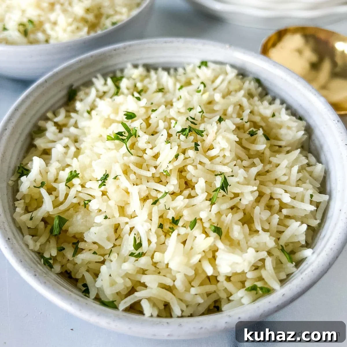 How to Make Fluffy Basmati Rice in an Instant Pot 5 A white bowl of Instant Pot Rice ready to serve.