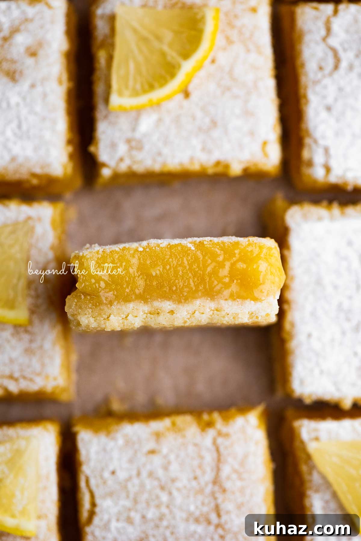 Tangy Lemon Bars with Buttery Shortbread Crust 4 Sliced super easy lemon bars on parchment paper