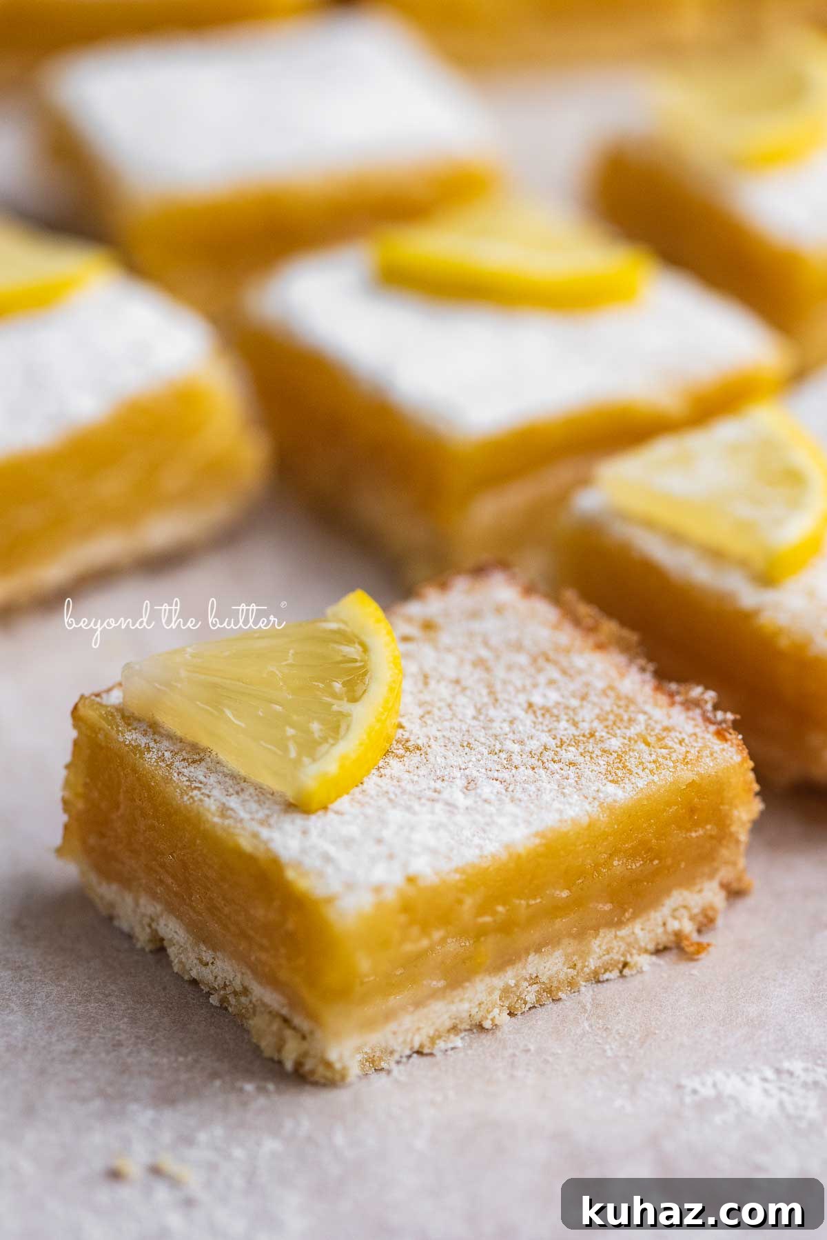 Tangy Lemon Bars with Buttery Shortbread Crust 5 Super easy lemon bars on parchment paper