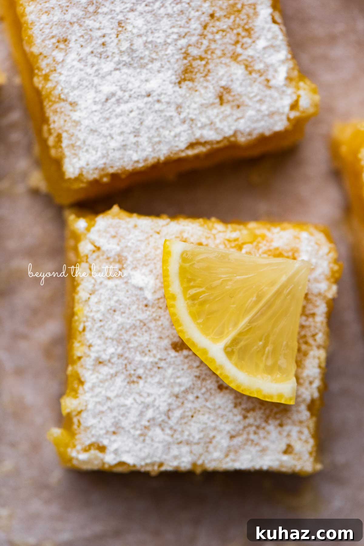 Tangy Lemon Bars with Buttery Shortbread Crust 6 Super easy lemon bars on parchment paper