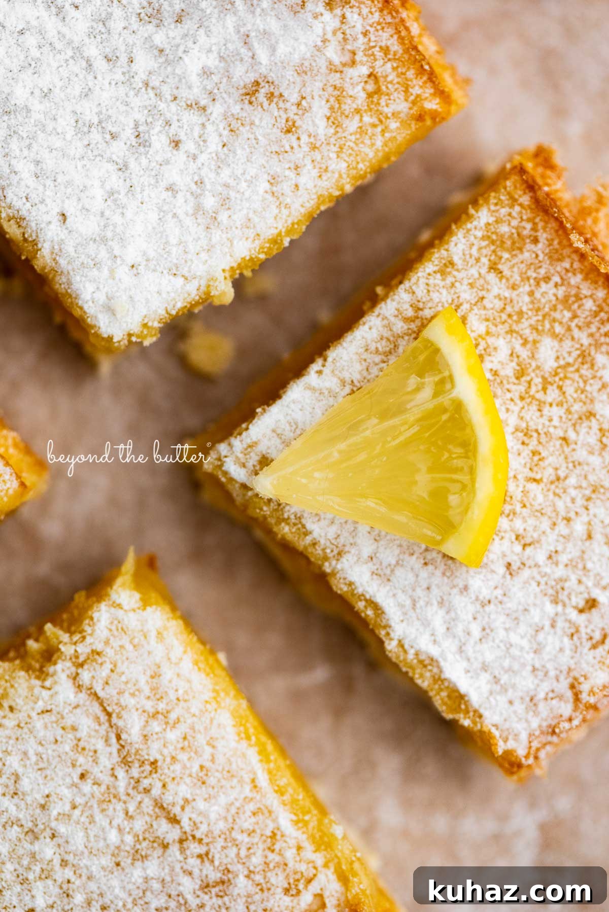 Tangy Lemon Bars with Buttery Shortbread Crust 8 Tart and tangy lemon bars on parchment paper