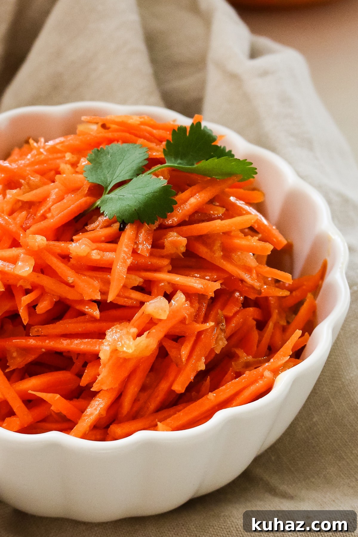 Spicy Morkovcha Korean Carrot Salad Recipe 9 korean carrot salad with cilantro in a white bowl.