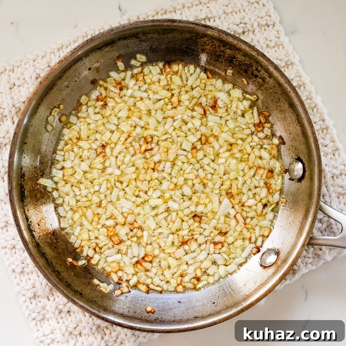 Spicy Morkovcha Korean Carrot Salad Recipe 5 onions in metal pan.