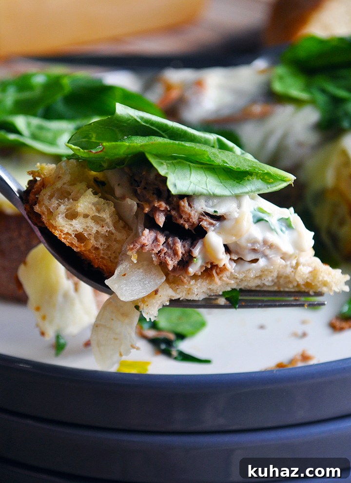Shredded Pot Roast Sandwiches with Au Jus 4 A bite of open face Pot roast sandwich