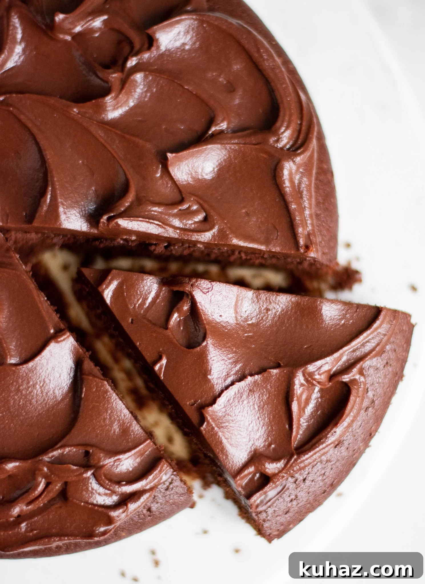 A chocolate cake with a slice cut out of it.