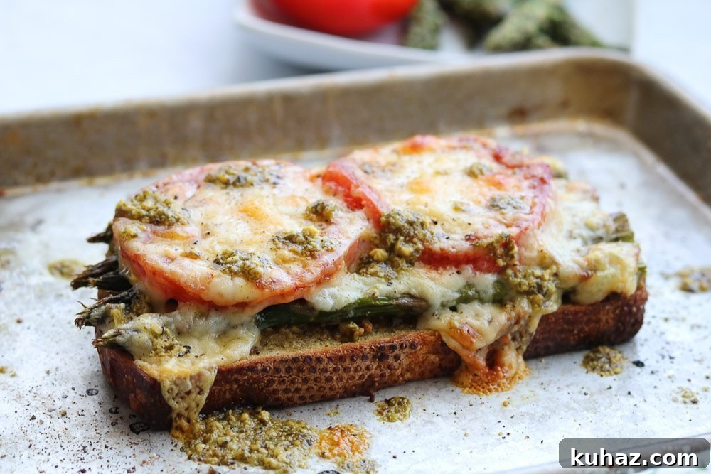 Roasted Asparagus and Tomato Pesto Melt Recipe 8 roasted asparagus tomato pesto melt on baking sheet