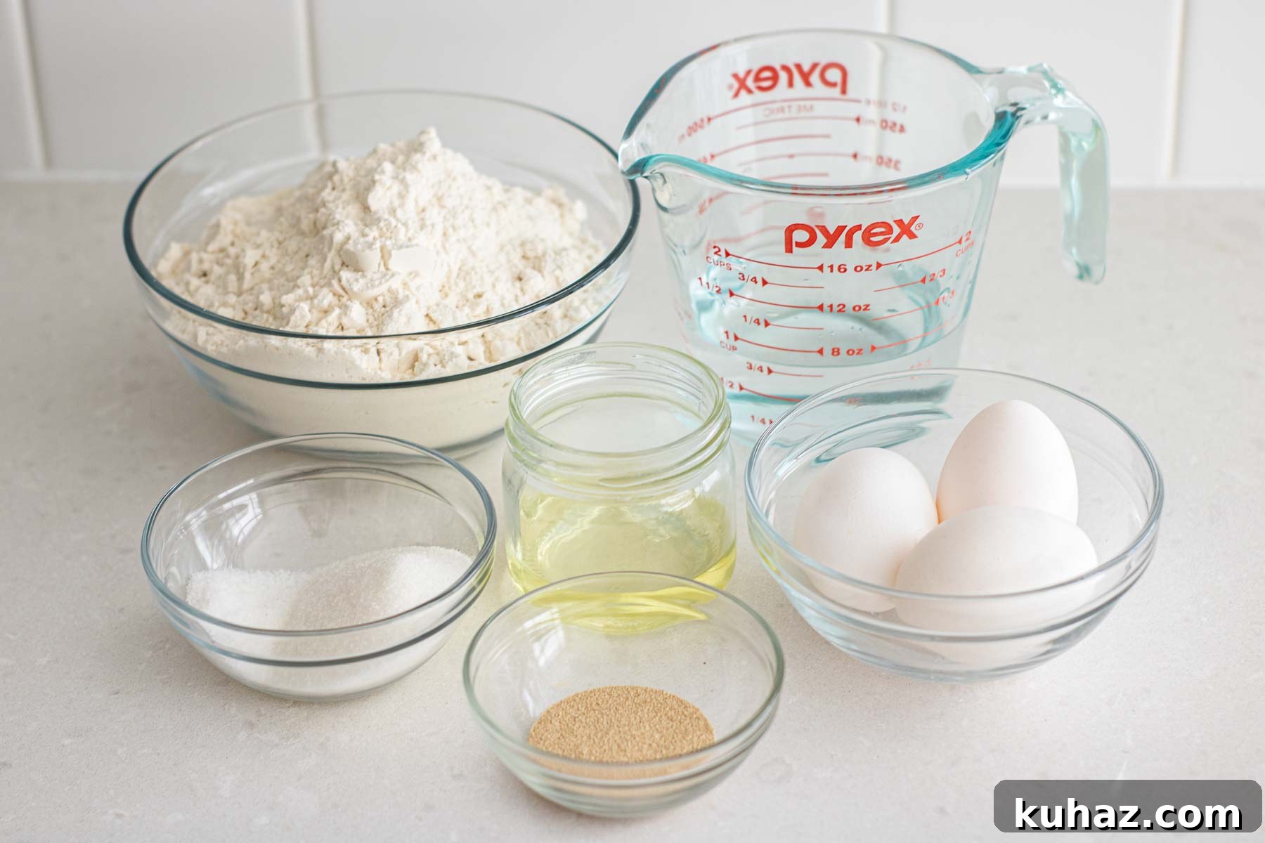 Soft Challah Rolls Recipe for Fluffy Challah Buns 3 Ingredients of a challah bun: sugar, salt, oil, yeast, flour, eggs and water.