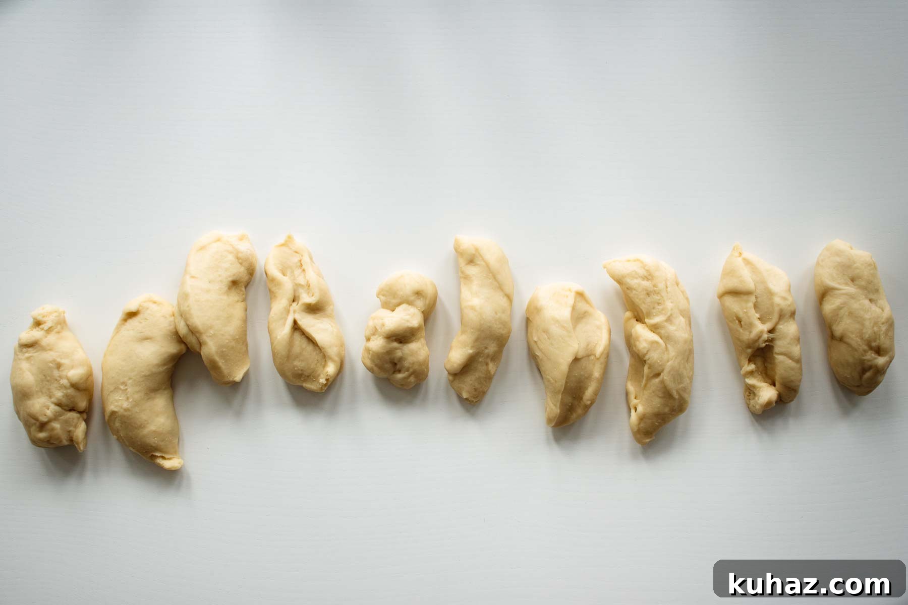 Soft Challah Rolls Recipe for Fluffy Challah Buns 7 Divided dough.