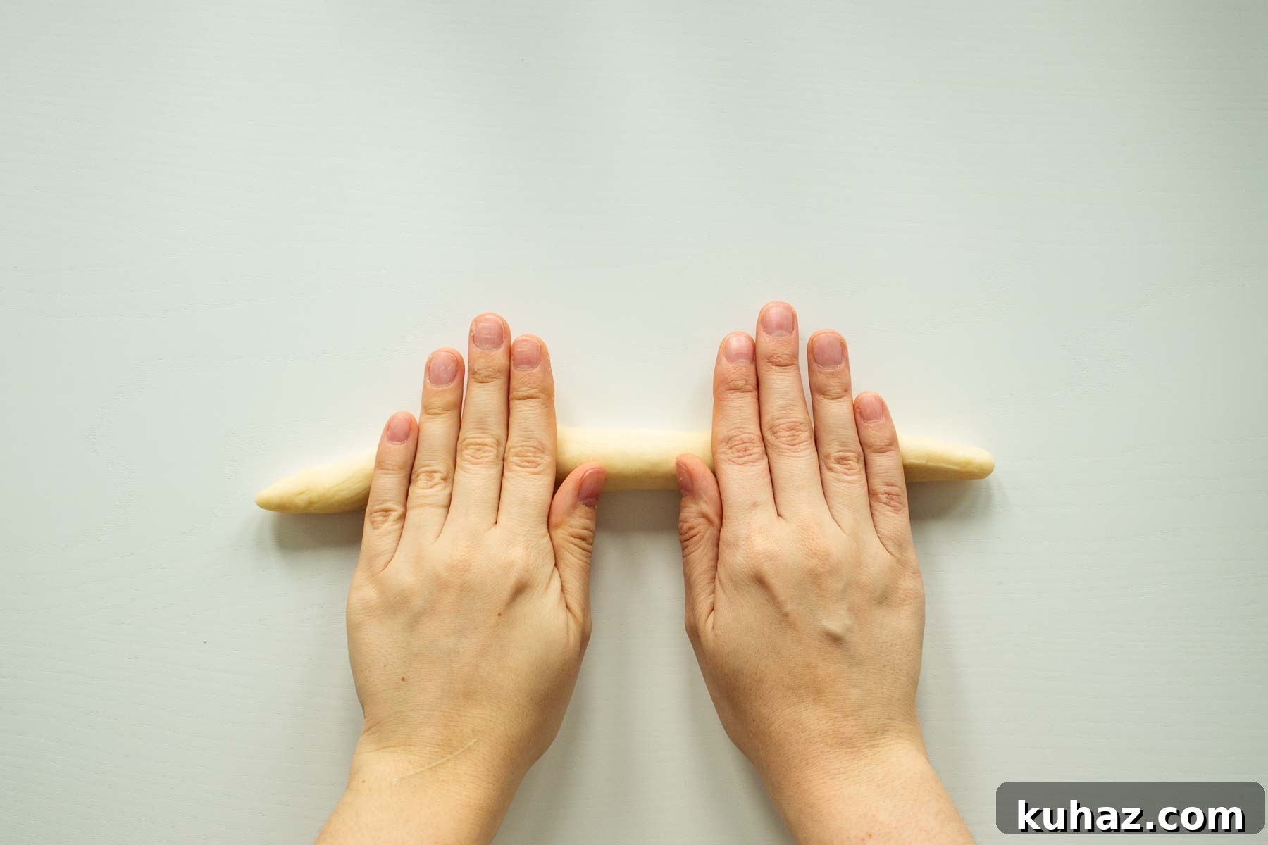 Soft Challah Rolls Recipe for Fluffy Challah Buns 8 Hand rolling dough.