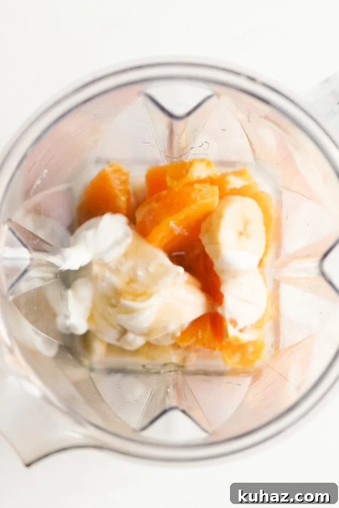 Orange Banana Smoothie Recipe 6 orange, banana, yogurt, honey, almond milk, vanilla, and ice in a blender