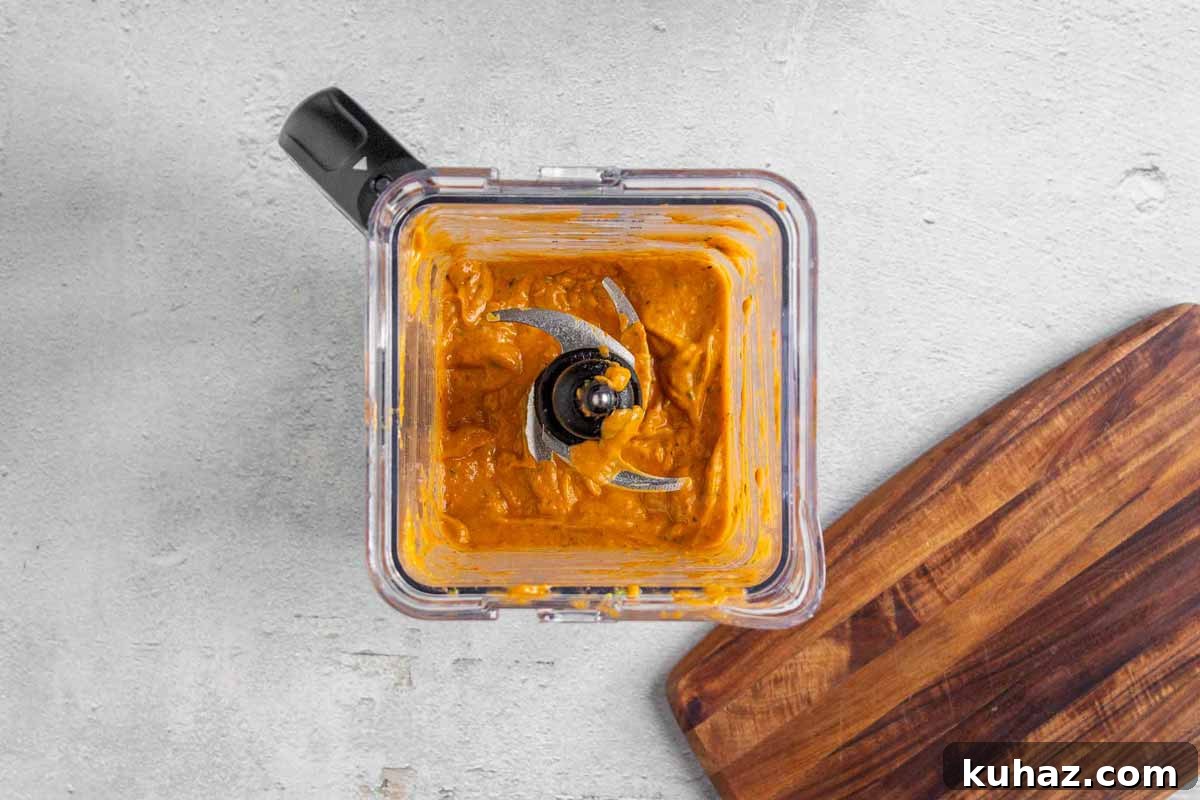 Creamy Avocado Bell Pepper Pasta 6 Avocado bell pepper ingredients in a blender blended until smooth, thick, and creamy. The sauce is a rich golden orange color.