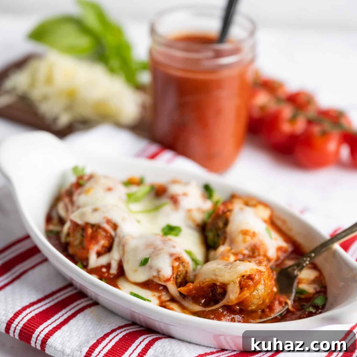 Baked Meatballs in Marinara with Melted Mozzarella 6 A dish of baked meatballs with marinara sauce.