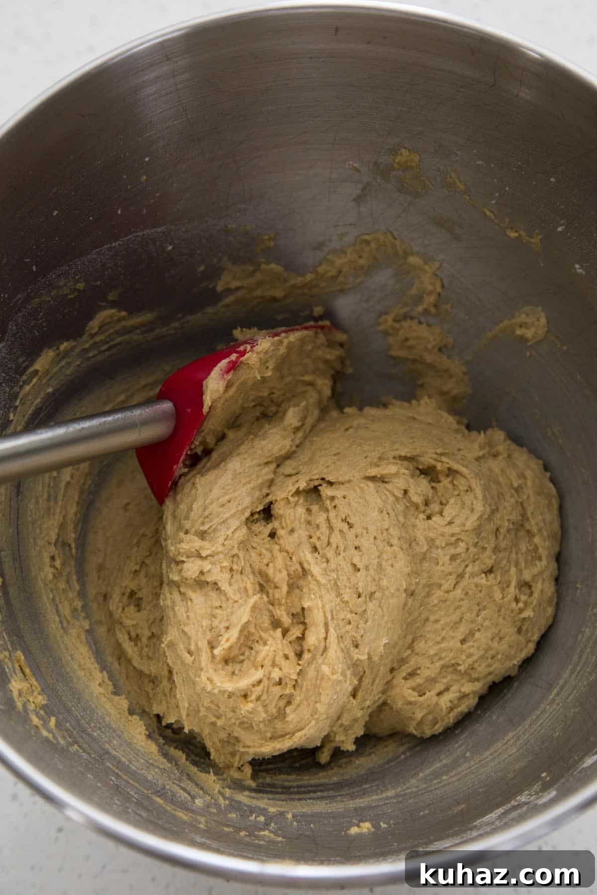 Pumpkin Snickerdoodle Cookies Recipe 3 Pumpkin snickerdoodle cookie dough in a mixing bowl.