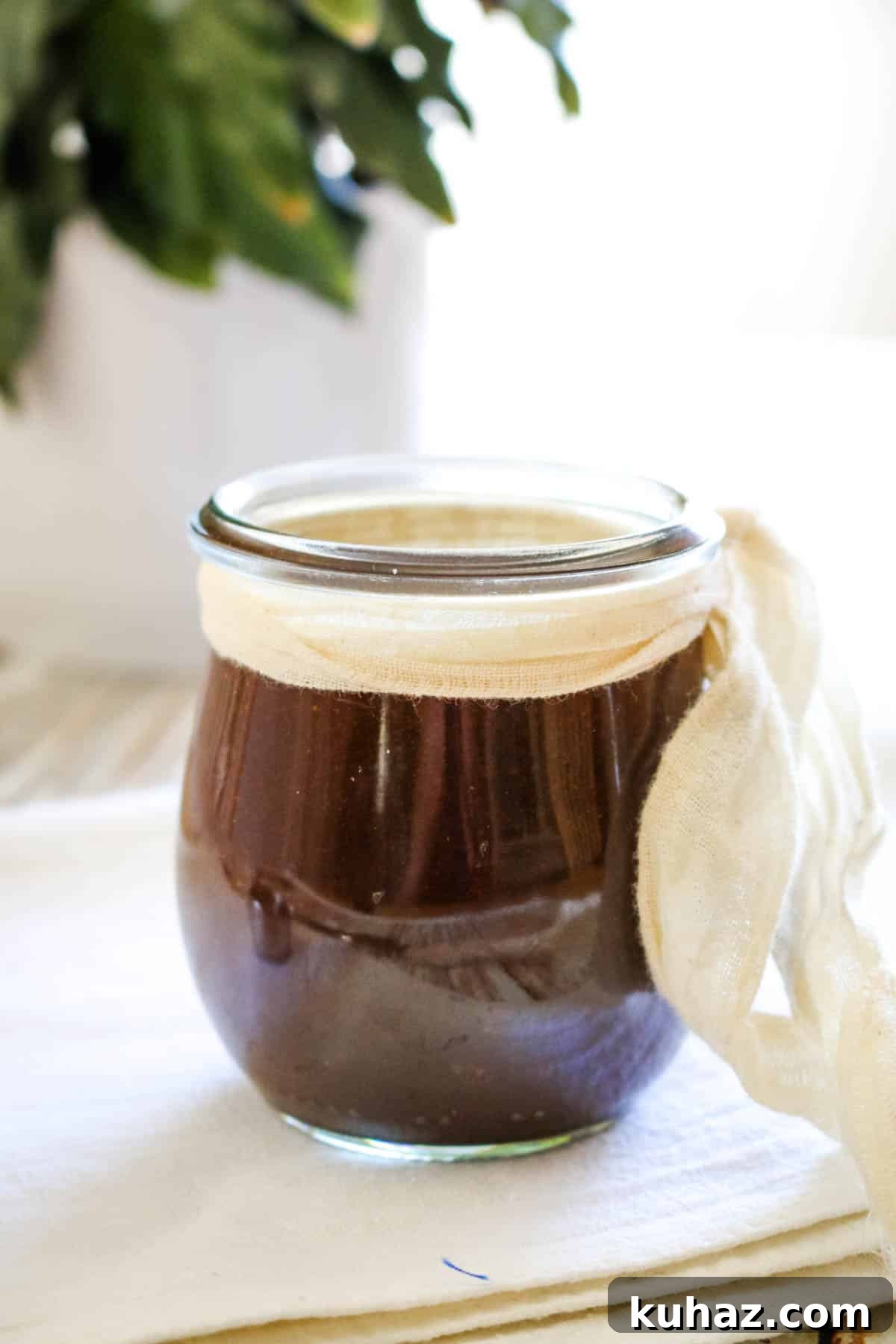 Homemade Worcestershire Sauce Recipe 2 dark Worcestershire sauce in a small jar with a white ribbon