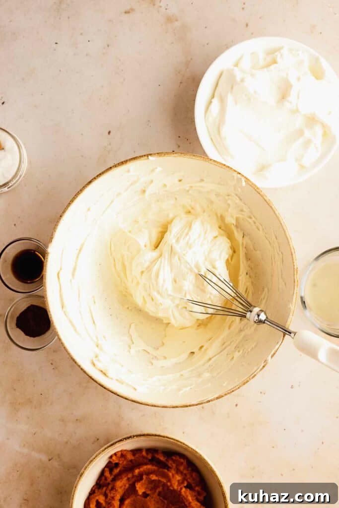 Creamy No-Bake Pumpkin Cheesecake Bars 8 beating cream cheese until smooth