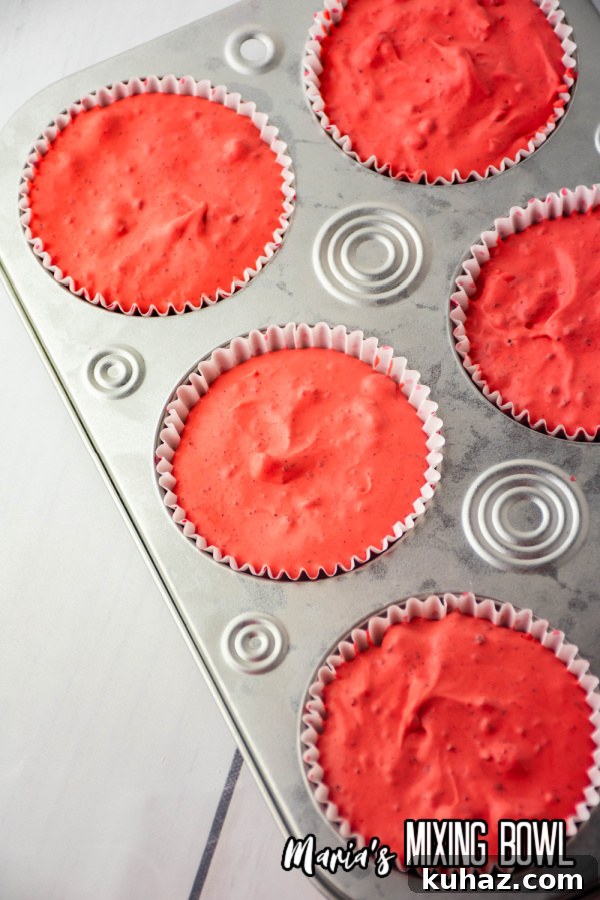 Overehad shot of no bake cheesecake batter in muffin tins