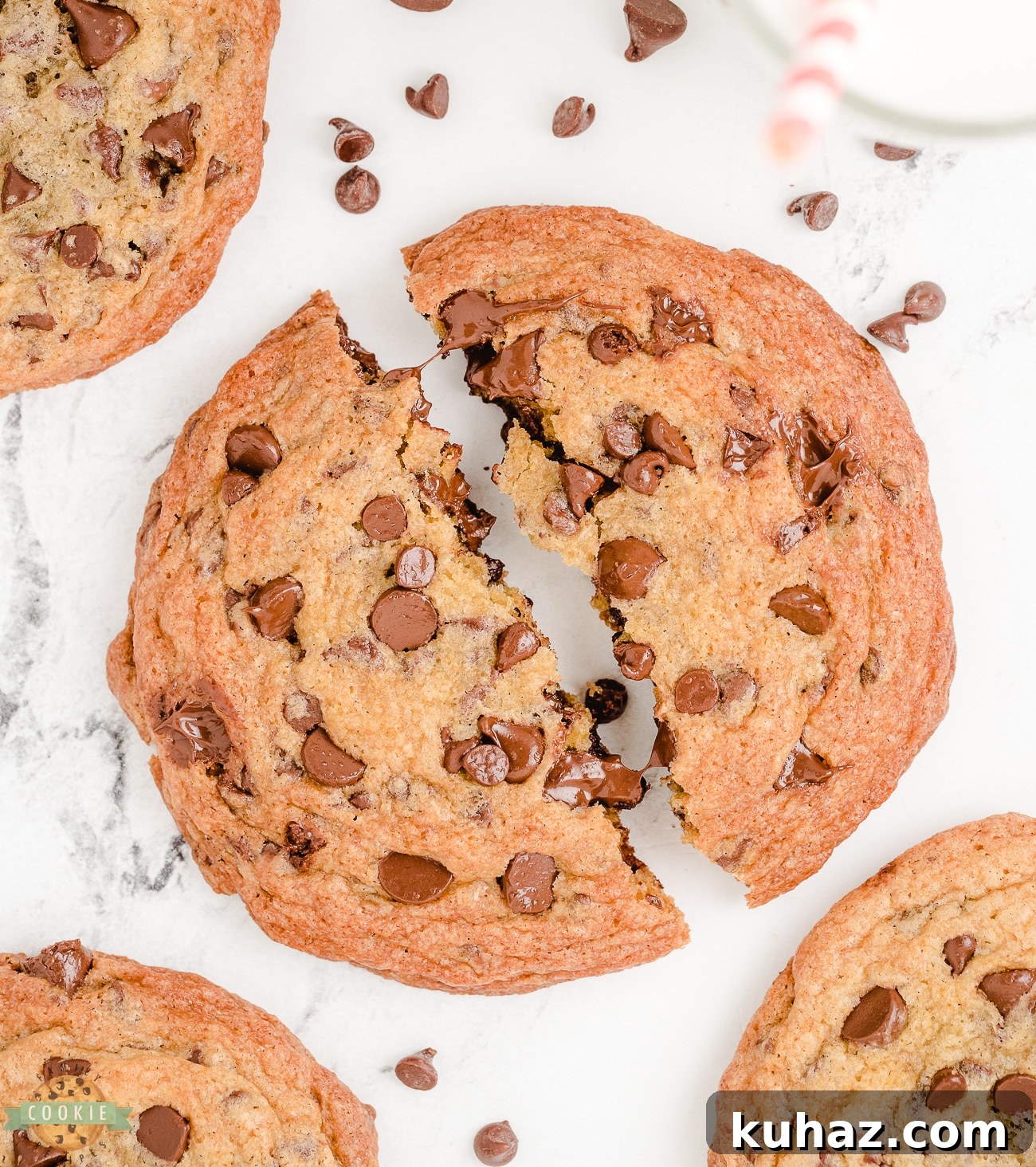 Giant Chocolate Chip Cookies Recipe 3 jumbo chocolate chip cookies broken in half with melting chocolate