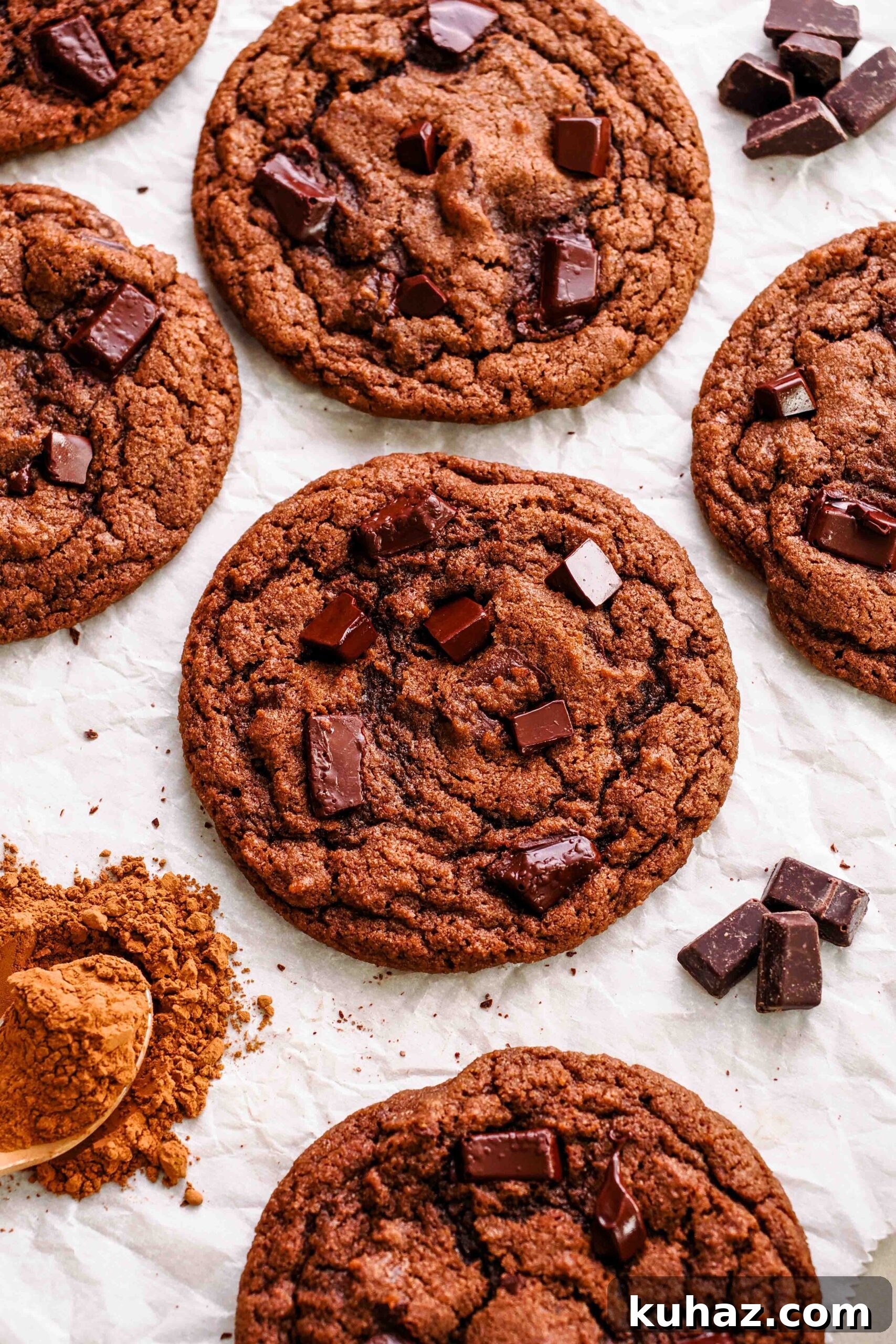 Chewy Double Chocolate Chip Cookies Recipe 2 Double chocolate chip cookies on crinkled parchment paper.