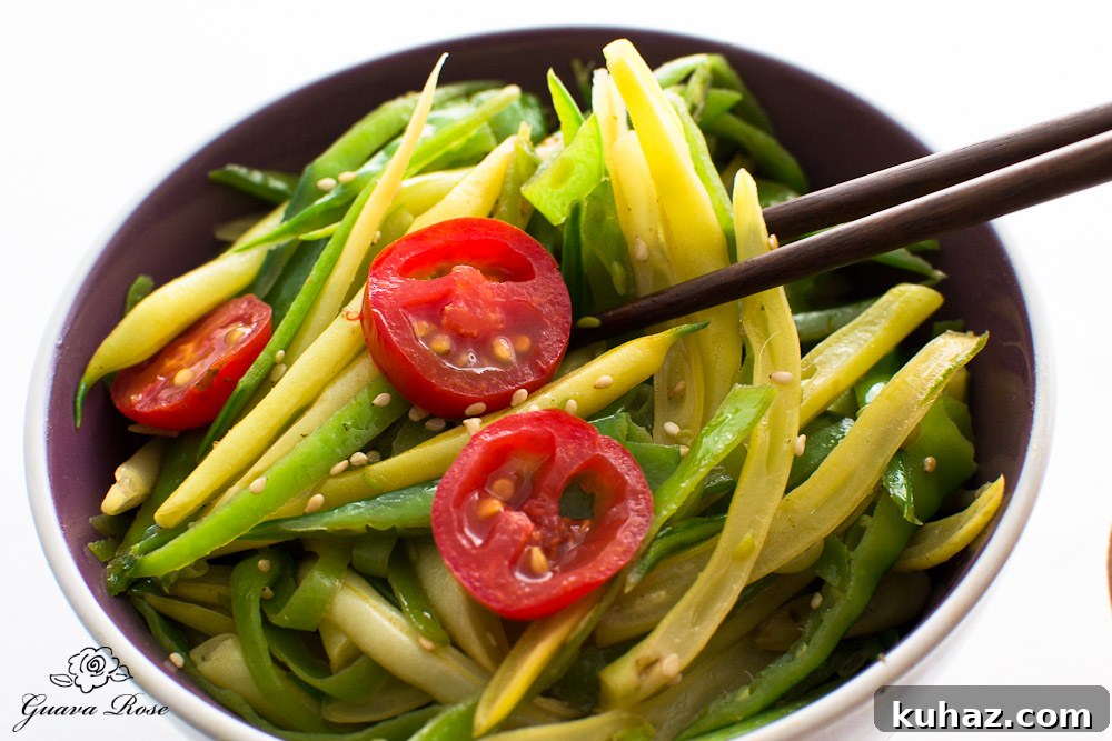 Stir-fried snow peas and yellow string beans with chopsticks Stir-fried snow peas and yellow string beans with chopsticks