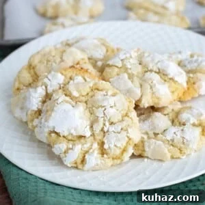 Sourdough lemon crinkle cookies on a plate.
