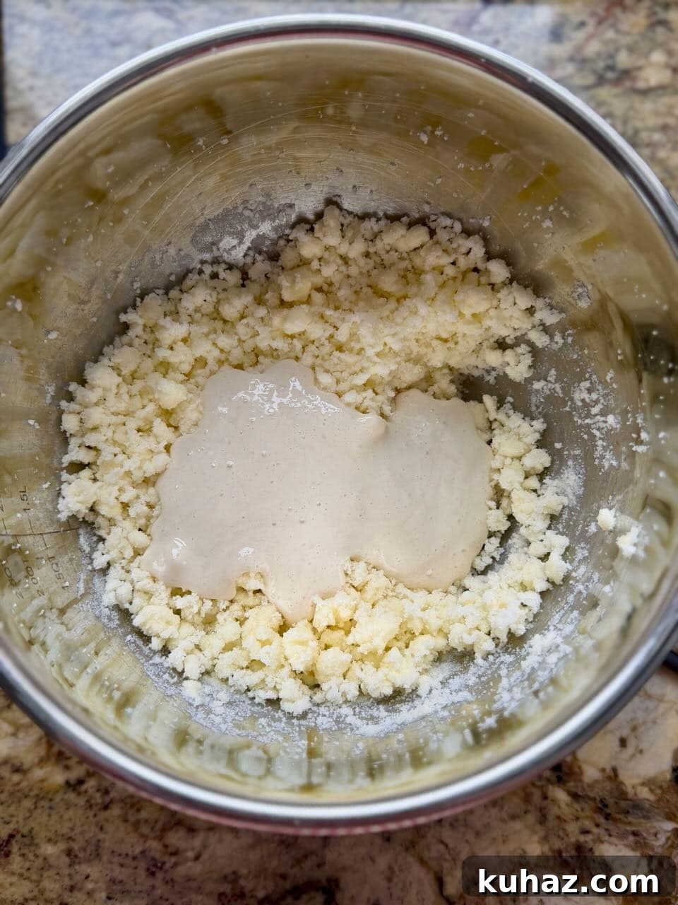 Lemon Crinkle Cookies Made with Sourdough Discard 4 Sourdough discard added to creamed butter and sugar mixture in a metal mixing bowl.
