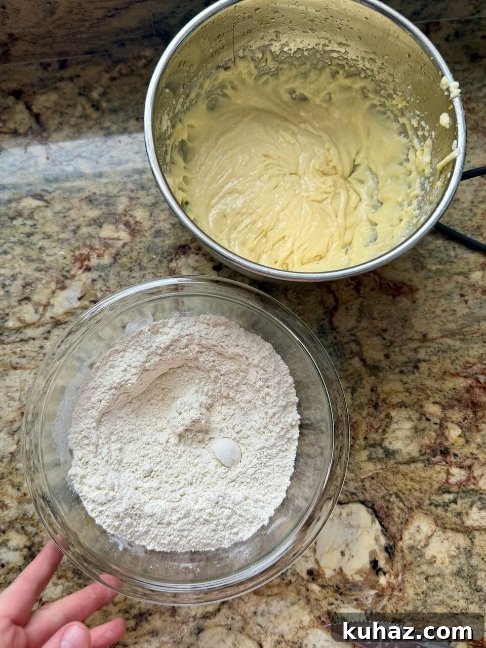 Lemon Crinkle Cookies Made with Sourdough Discard 6 Lemon cookie dough mixed in a bowl with a separate bowl of dry ingredients ready to combine.