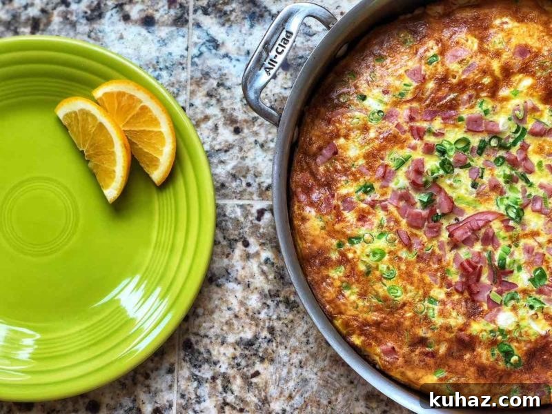 Corn and Gruyere Frittata with Canadian Bacon (4 WW Points) 2 A pan of frittata, next to an orange slice