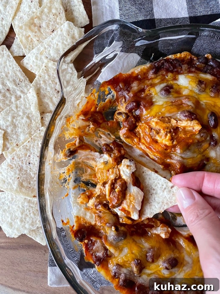 3-Ingredient Chili Cheese Dip Recipe 2 Are you looking for easy party appetizer to make for a party? You've got to try this 3 ingredient chip dip! It's so simple to make with just cream cheese, cheddar, and a can of chili. Layer and bake for the best party food, ever! This is my favorite appetizer to make for family gatherings, especially on football Sunday or game day.