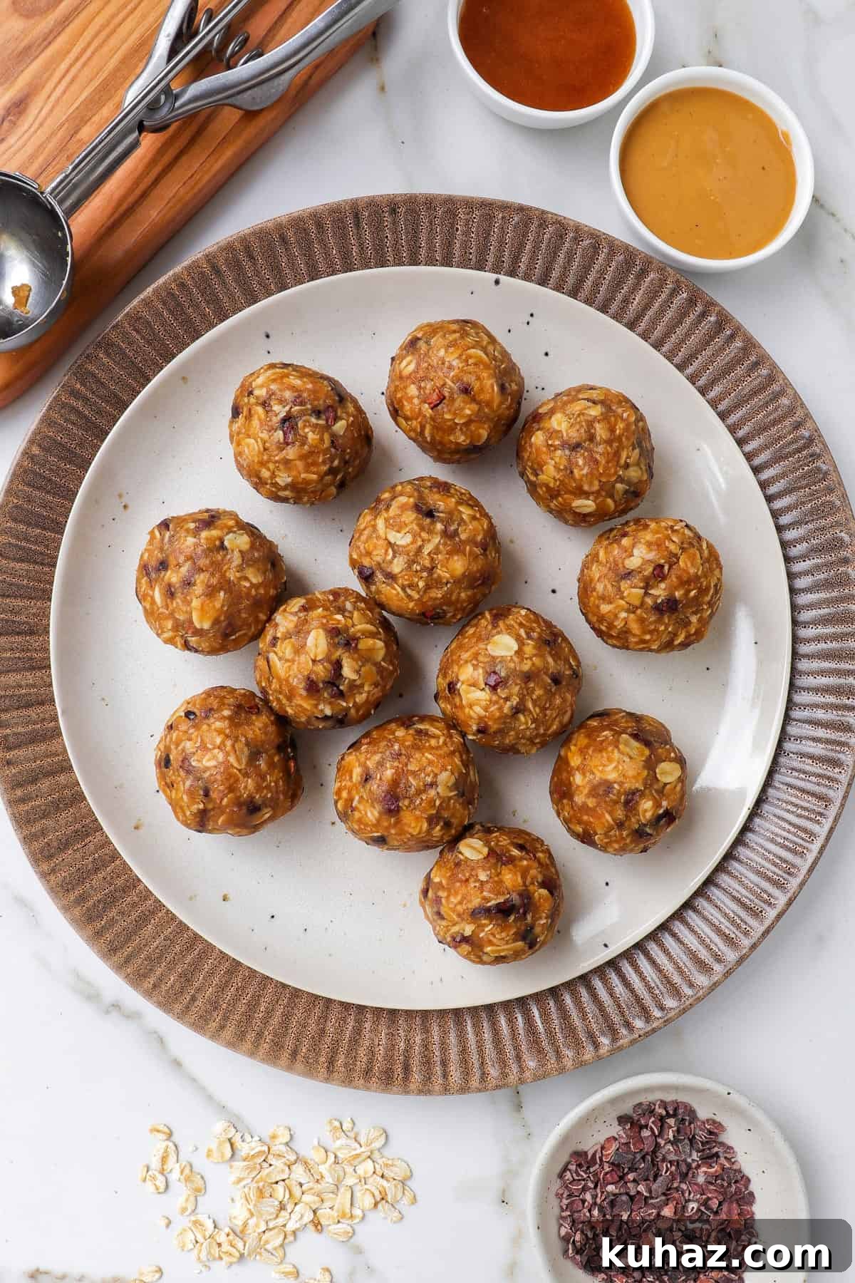 No-Bake Peanut Butter Bliss Balls: Protein-Packed Bites 3 Peanut butter bliss balls on a plate.