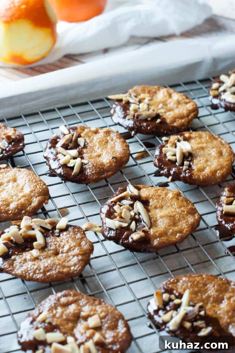 Almond Orange Cookies: Gluten-Free Paleo GAPS Recipe 2 Almond Orange Cookies -Crispy thin almond cookies are dunked in chocolate ganache and topped with toasted almonds. These cookies are naturally gluten free, primal, paleo and GAPS.
