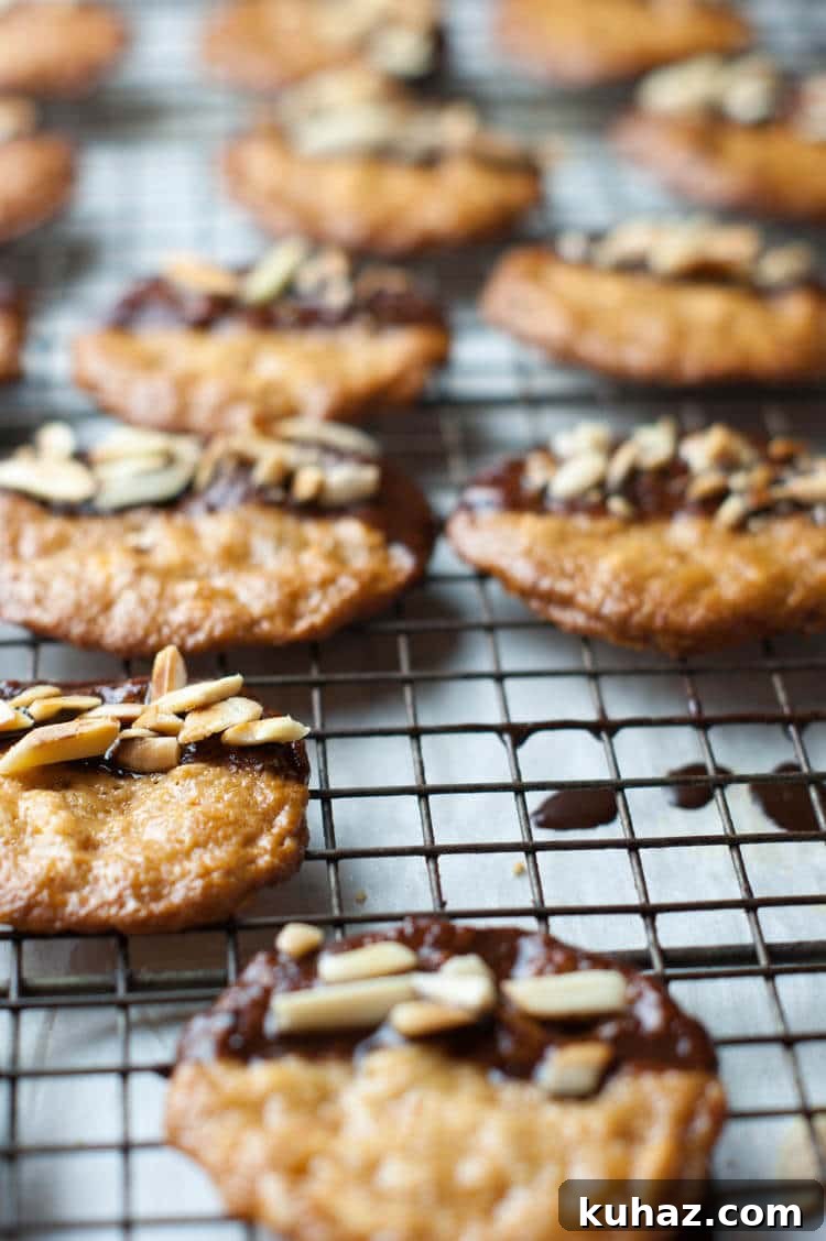 Almond Orange Cookies: Gluten-Free Paleo GAPS Recipe 4 Almond Orange Cookies -With hints of orange zest, these crispy thin almond cookies are dunked in chocolate and topped with toasted almonds. These Almond Orange Cookies are naturally gluten free, primal and GAPS with Paleo version.