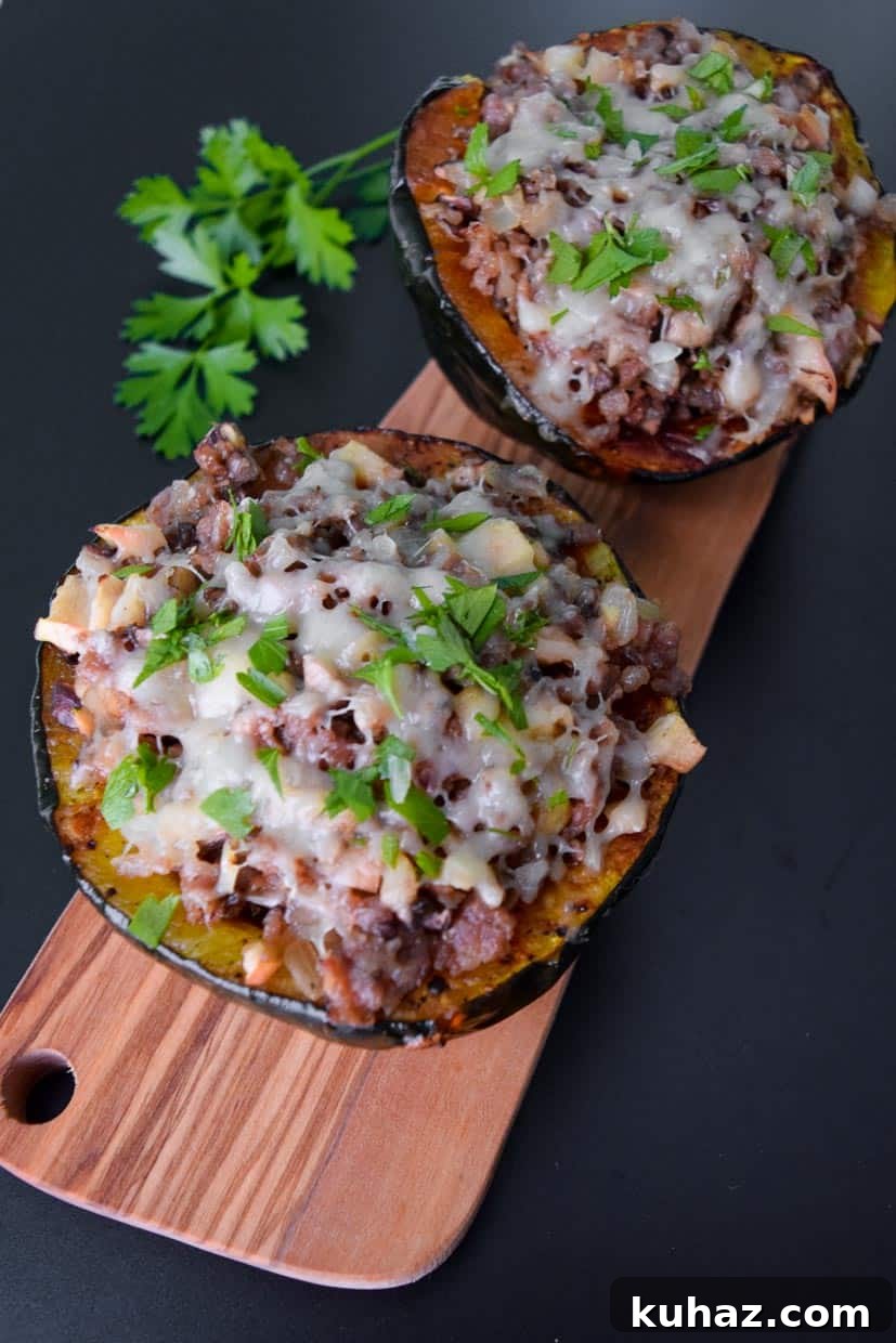 Roasted Acorn Squash Stuffed with Sausage, Mushrooms and Apples 3 Stuffed Acorn Squash on wooden platter topped with parsley