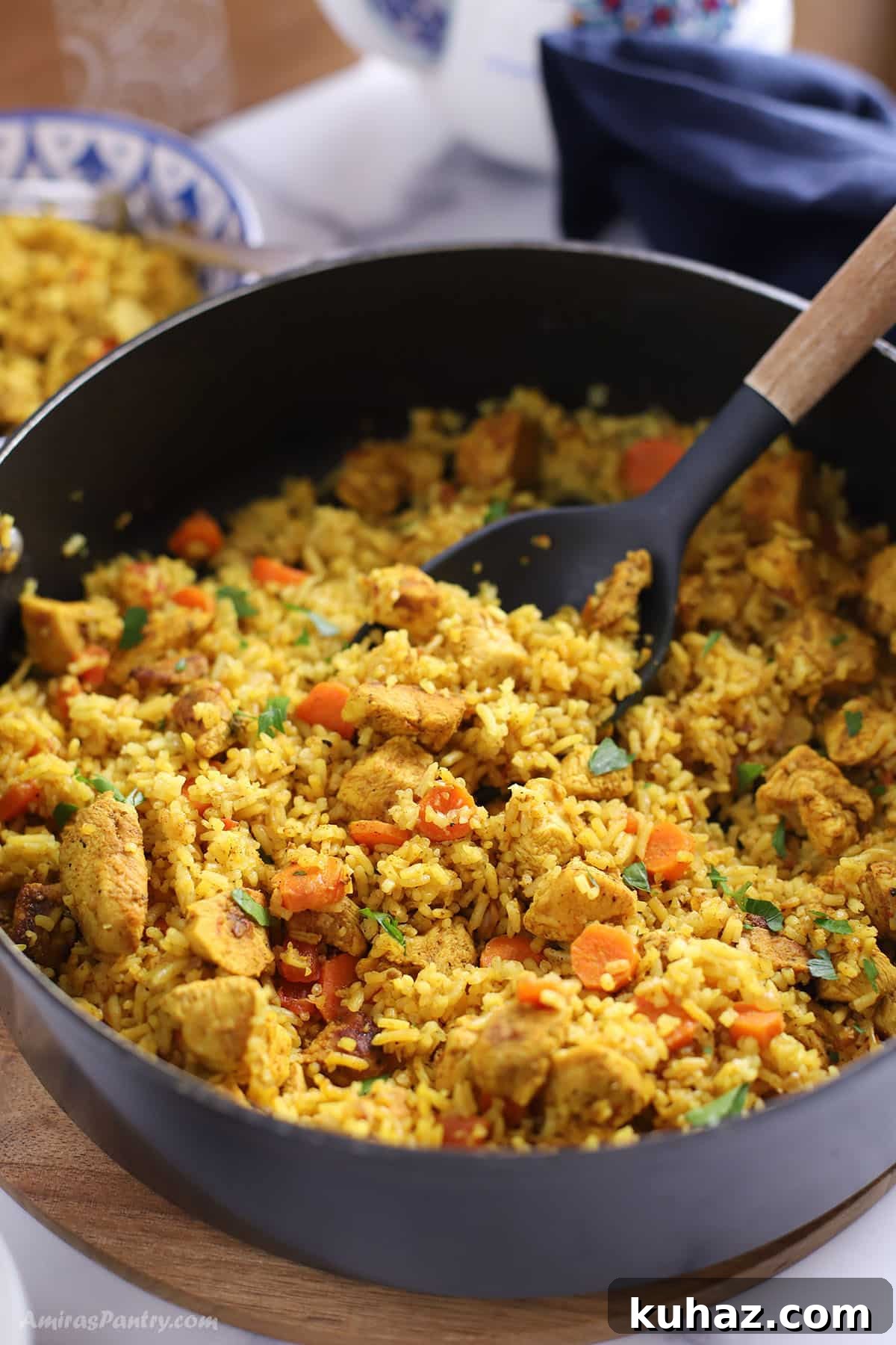 Moroccan Chicken with Saffron Rice 2 A large skillet with rice and chicken.