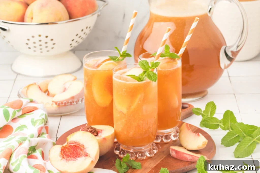 Southern Peach Iced Tea Recipe with Fresh Peaches 6 three glasses of peach tea on wooden serving platter with a pitcher of tea in the background