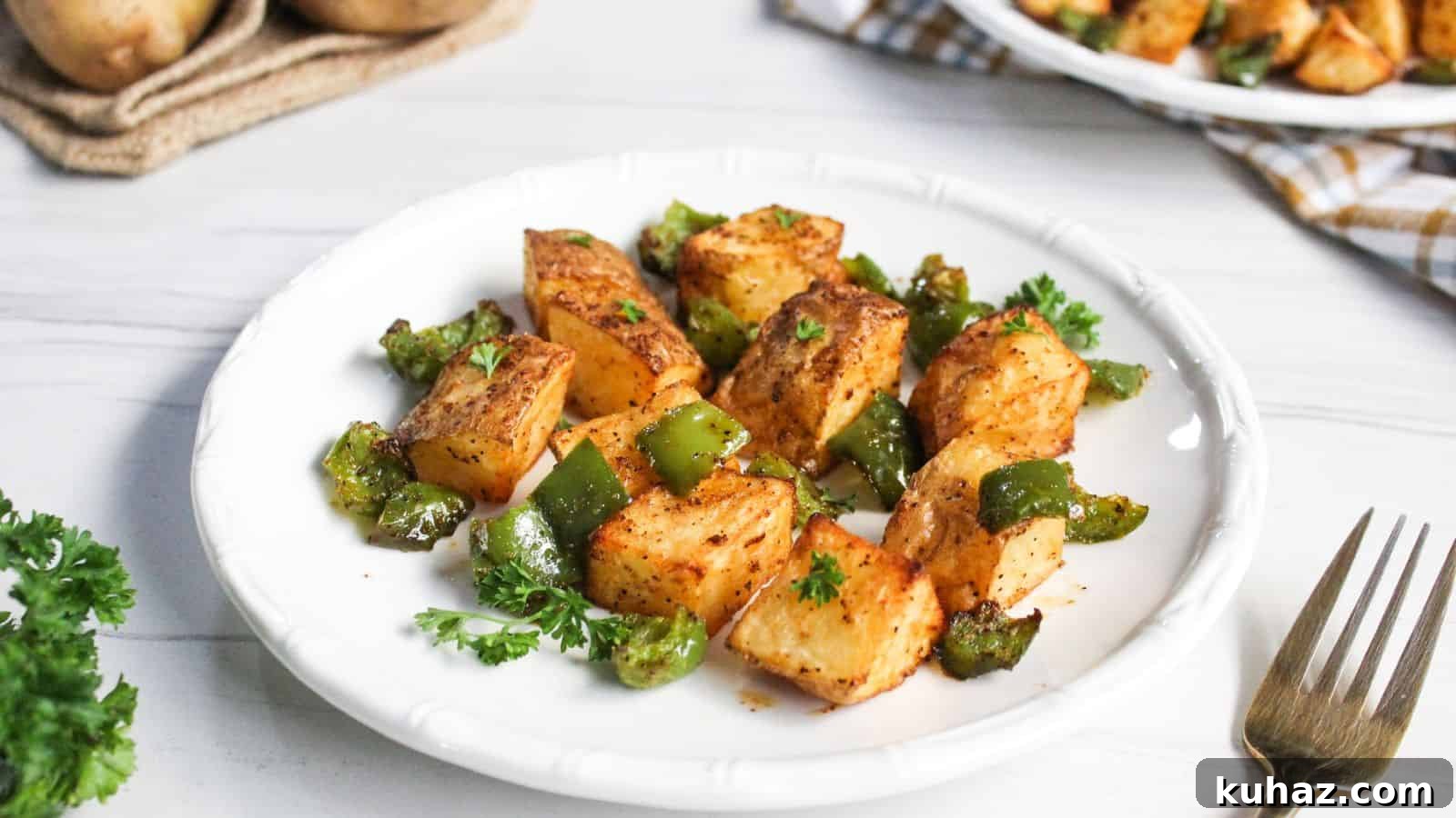 13 Gluten-Free Breakfast Recipes to Kickstart Your Morning 9 Air-fried potato cubes with diced green bell peppers on plate.
