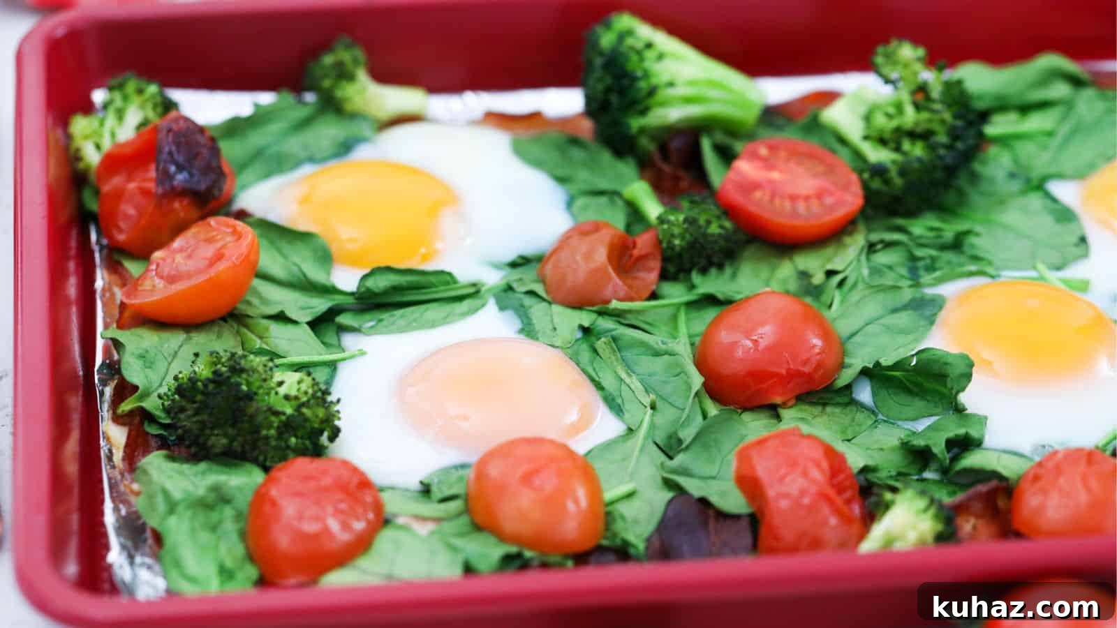 13 Gluten-Free Breakfast Recipes to Kickstart Your Morning 10 Sheet pan with cooked eggs, spinach, tomatoes, broccoli, and bacon.