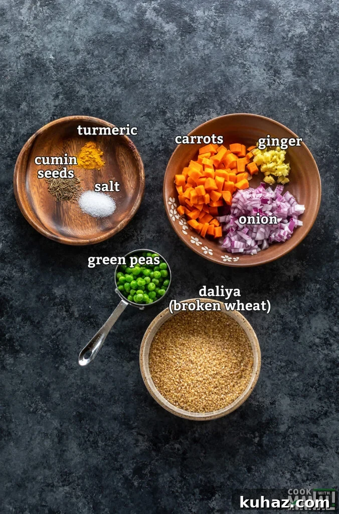 Instant Pot Vegetable Daliya Recipe (Broken Wheat Khichdi) 3 ingredients for making vegetable daliya arranged on a board
