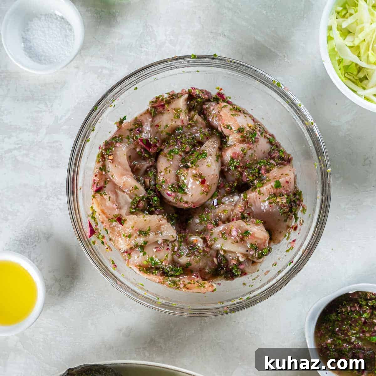 Grilled Chimichurri Chicken Tacos with Lime & Cilantro 6 Chicken in a bowl marinating in chimichurri sauce.