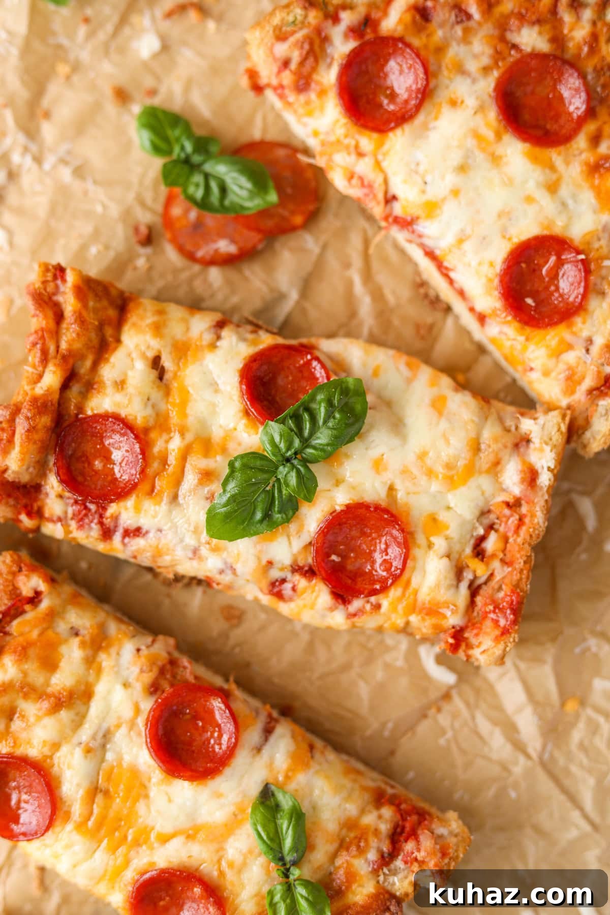 Homemade French Bread Pizza Recipe 2 Slices of rectangular pizza, topped with pepperoni slices.