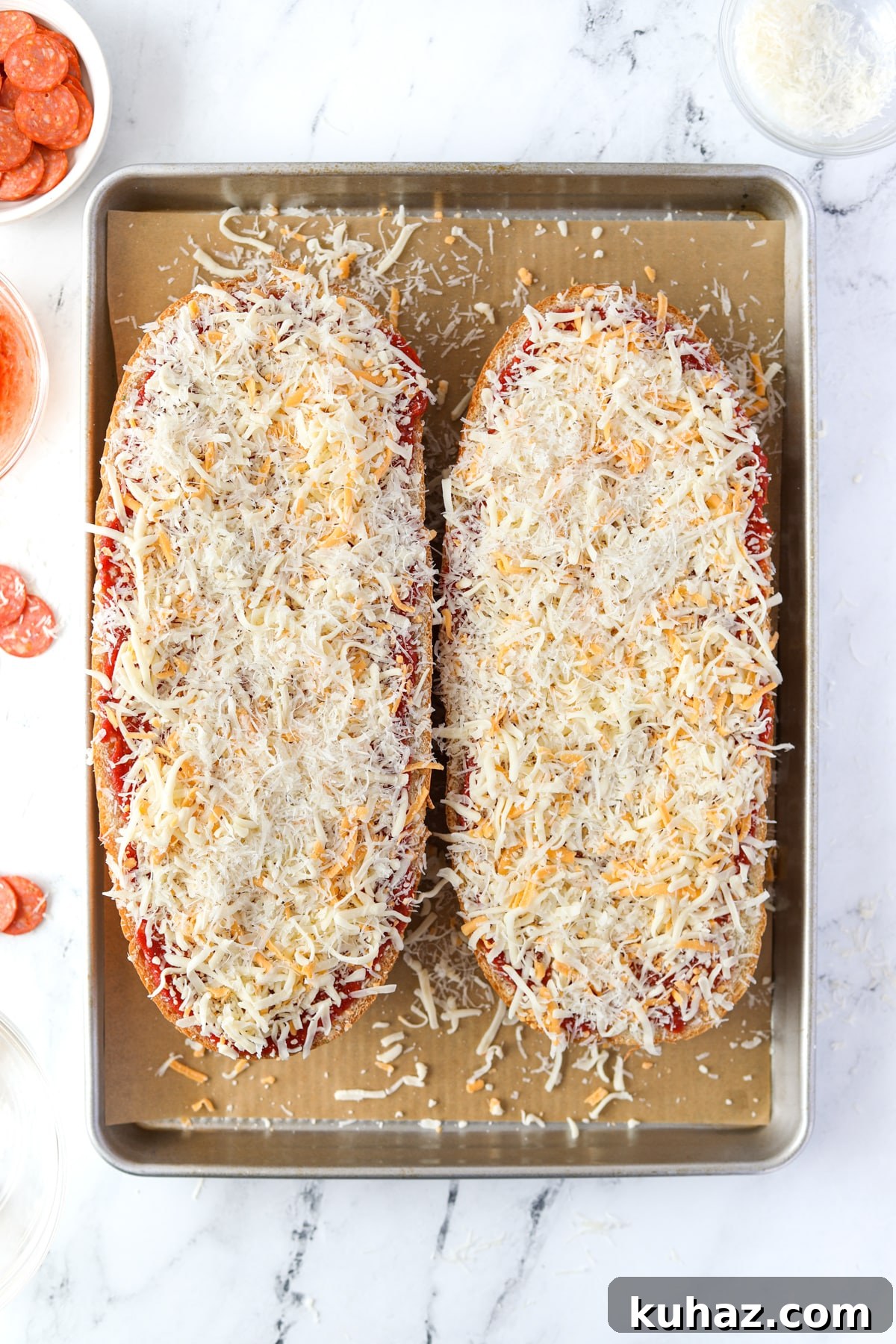 Homemade French Bread Pizza Recipe 6 French bread topped with shredded cheese.