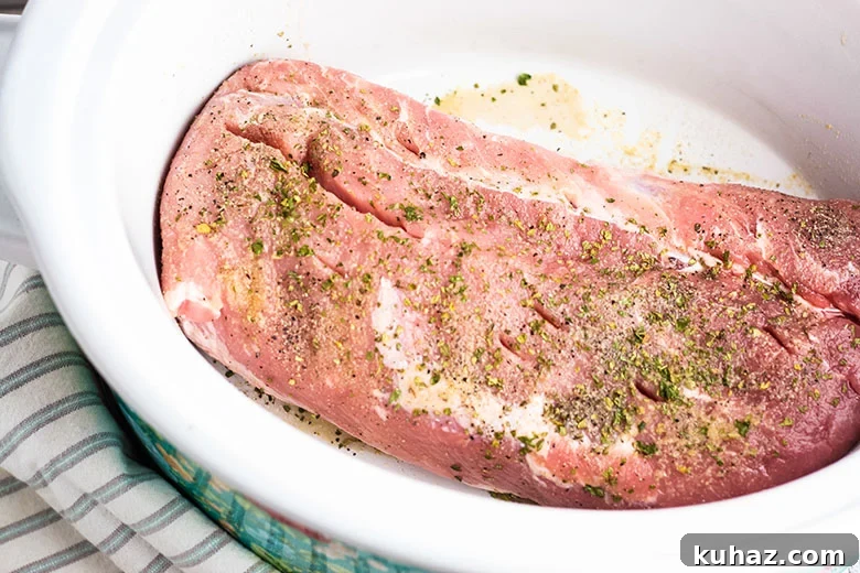Slow Cooker Pork Tenderloin with Savory Gravy 4 Uncooked Pork Tenderloin In Slow Cooker with seasoning sprinkled on top