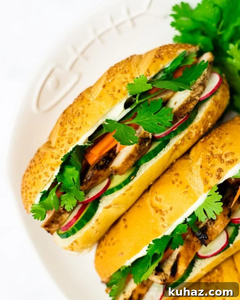 Grilled Chicken Banh Mi Sandwich with Pickled Veggies 2 A top down view of a plate of grilled chicken banh mi sandwiches.