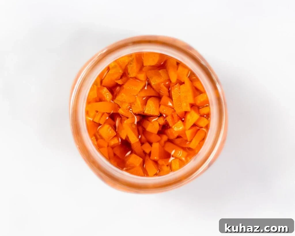 Grilled Chicken Banh Mi Sandwich with Pickled Veggies 4 A top down view of pickled carrots in a mason jar.