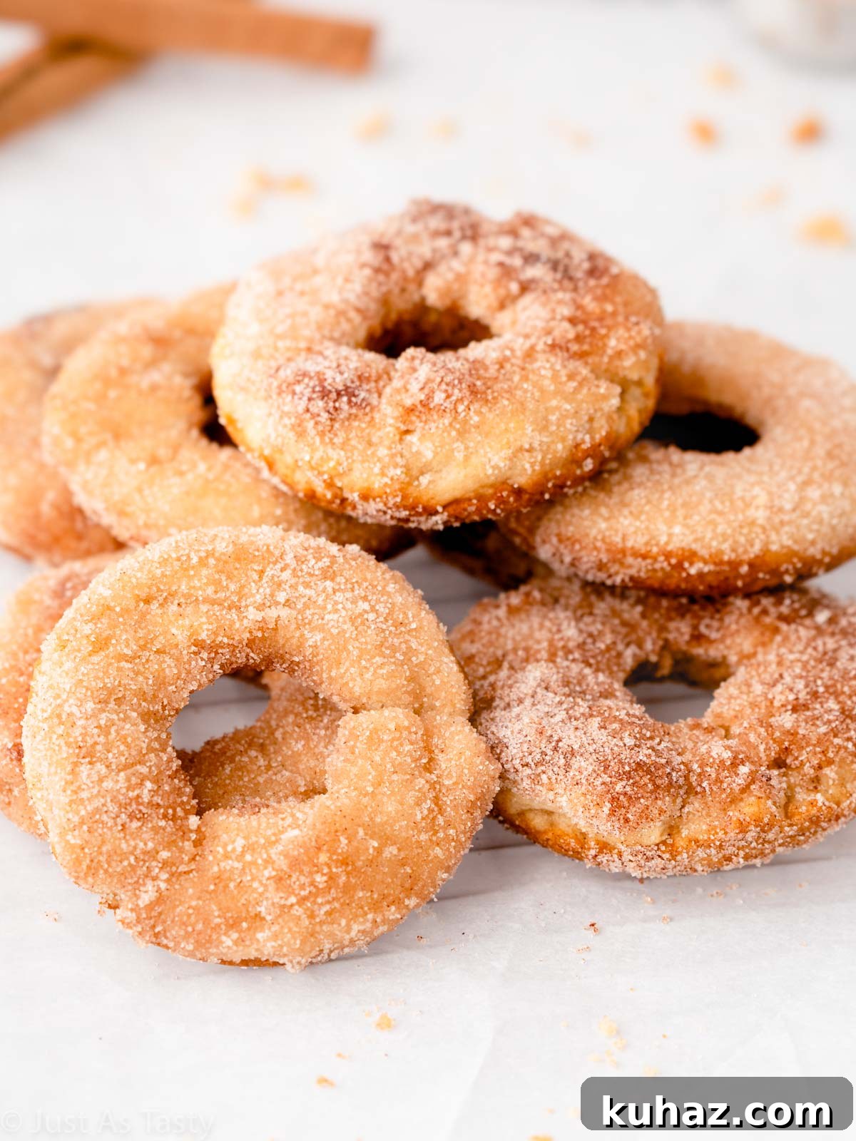 Apple cider donuts on parchment paper. 