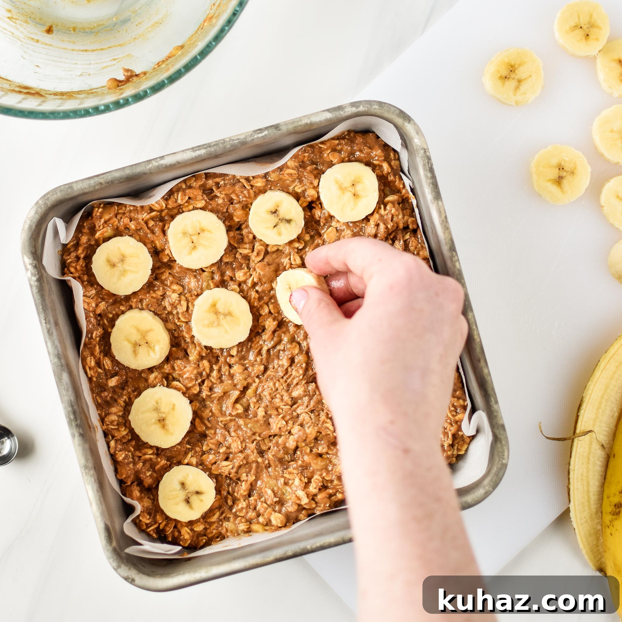 Homemade Peanut Butter Banana Oatmeal Breakfast Bars 9 Adding sliced bananas to the PB Banana Oatmeal Breakfast bars